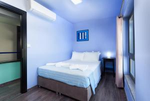 A bed or beds in a room at Villa Menelaos