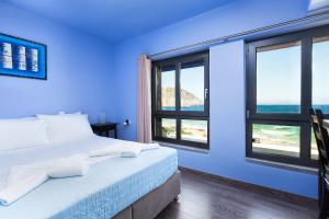 A bed or beds in a room at Villa Menelaos