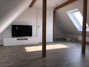 Et tv og/eller underholdning på Ferienhaus Villa Wunderbar Dangast im Nordsee Park am Jadebusen