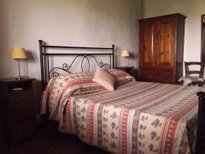 a bedroom with a bed with a comforter on it at Le Case Del Vivaio in Sciacca +89 photos