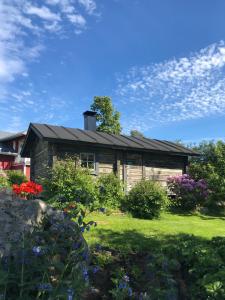 a house with a garden in front of it at Citymökki in Kristinestad +19 photos