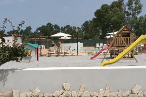two pictures of a playground with a slide at Tindari Village Camping in Furnari