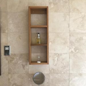 a shelf in a shower with a bottle on it at Ashtree House Hotel, Glasgow Airport & Paisley in Paisley