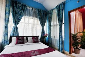 Letto o letti in una camera di LikeMyHome Homestay Mysore