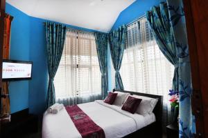Letto o letti in una camera di LikeMyHome Homestay Mysore