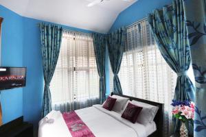 Letto o letti in una camera di LikeMyHome Homestay Mysore