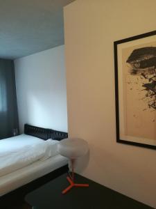 En eller flere senge i et værelse på Hotel Sonderborg