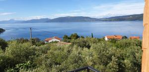 a view of a large body of water with houses at Apartment Marina in Valun