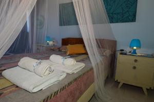Letto o letti in una camera di Anna Koralli Studios