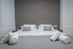 Giường trong phòng chung tại Ibericabeds Granada