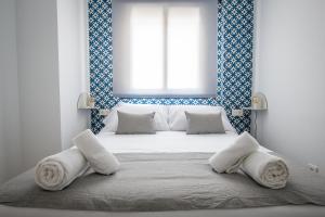 Posteľ alebo postele v izbe v ubytovaní Ibericabeds Granada