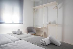 Posteľ alebo postele v izbe v ubytovaní Ibericabeds Granada