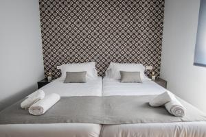 Posteľ alebo postele v izbe v ubytovaní Ibericabeds Granada