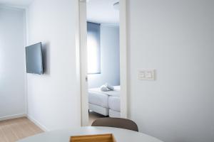 Posteľ alebo postele v izbe v ubytovaní Ibericabeds Granada