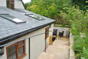 a view from the roof of a house with a patio at Higher Brockwell Annexe in Wootton Courtenay