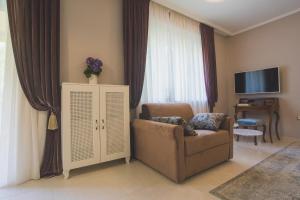 Televízia a/alebo spoločenská miestnosť v ubytovaní Luxury Apartment Padre Pio