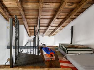 a room with a staircase and a bed in it at Casa da Fonte / Fountain House in Monsaraz