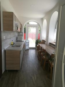 A kitchen or kitchenette at Halász Vendégház