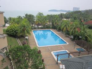 an overhead view of a swimming pool in a resort at Seri Bulan Condo in Port Dickson