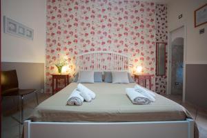 A bed or beds in a room at A Corte