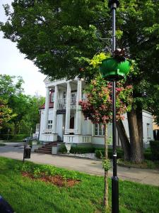 a street light in front of a white house at Villa Solankowa in Inowrocław