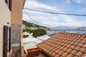 a view of the water from a balcony of a building at Apartments Riva in Baška