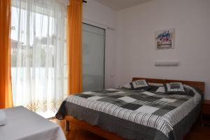 Postel nebo postele na pokoji v ubytování Apartments Josip