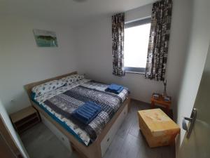 Ένα ή περισσότερα κρεβάτια σε δωμάτιο στο Sunrise Apartments