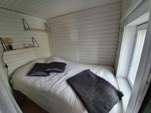 Säng eller sängar i ett rum på Kesämökki Tanela