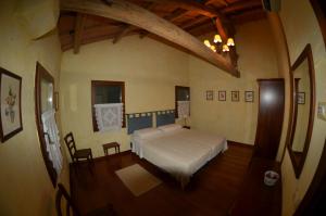 Postel nebo postele na pokoji v ubytování Locanda Antico Fighèr