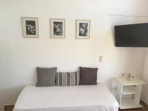 A bed or beds in a room at Theodosia Studios