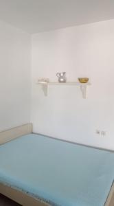 Postel nebo postele na pokoji v ubytování Kerasies Studios