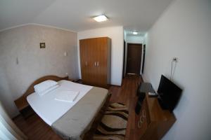 Postel nebo postele na pokoji v ubytování Vila Trandafir