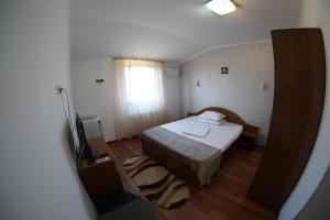 Postel nebo postele na pokoji v ubytování Vila Trandafir