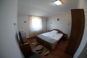 Postel nebo postele na pokoji v ubytování Vila Trandafir