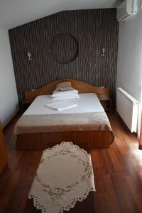 Postel nebo postele na pokoji v ubytování Vila Trandafir