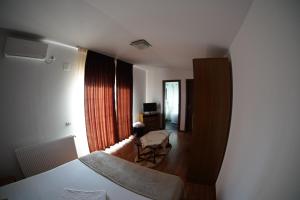 Postel nebo postele na pokoji v ubytování Vila Trandafir
