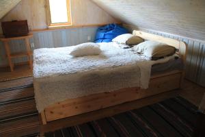 Postel nebo postele na pokoji v ubytování Posti Holiday Home