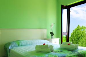 Ένα ή περισσότερα κρεβάτια σε δωμάτιο στο Agriturismo Vulcano