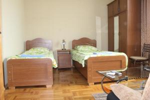 Voodi või voodid majutusasutuse Hotel Elegant toas
