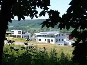 a group of buildings on top of a hill at Haus Bodenseeblick in Bodman-Ludwigshafen +18 photos