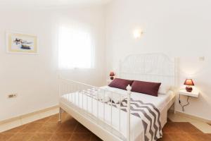 Posteľ alebo postele v izbe v ubytovaní Apartmani Mikulić