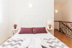 Posteľ alebo postele v izbe v ubytovaní Apartmani Mikulić