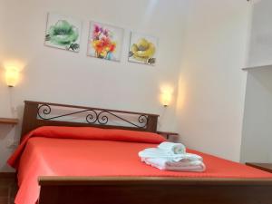 Postel nebo postele na pokoji v ubytování Cala San Francesco B&B