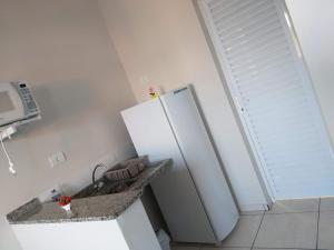 Ванная комната в Apartamento / Kitnetes