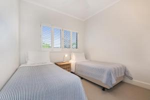 Voodi või voodid majutusasutuse Mirra Chana Beachfront Apartments Mooloolaba toas