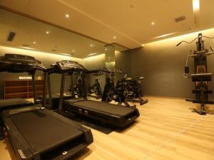 a gym with bikes and exercise equipment in a room at Atour Hotel Hefie Binghu Yingtai City Branch in Hefei