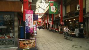 a person riding a bike in a shopping mall at Hotel Sting in Tokyo