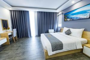 Voodi või voodid majutusasutuse Dang's Hotel toas