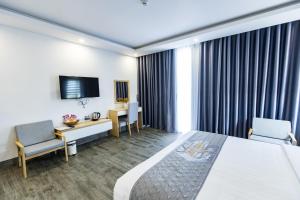 Voodi või voodid majutusasutuse Dang's Hotel toas